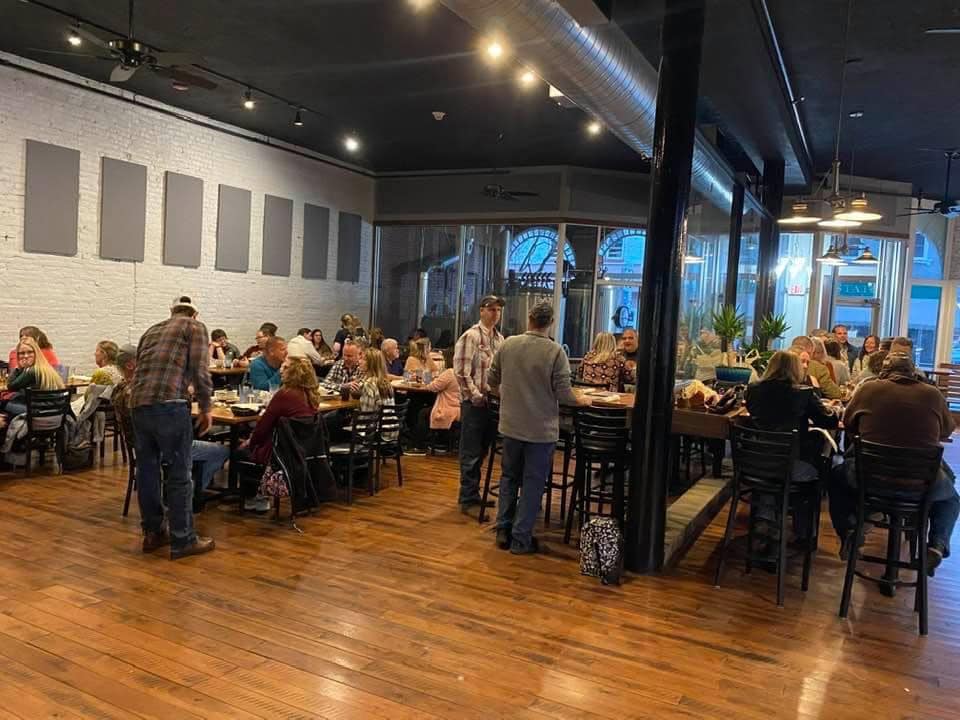 Interior of Fat Chad's Brewing with customers at Event.
